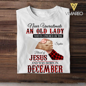 Personalized Never Underestimate An Old Lady Who Is Covered By The Blood Of Jesus And Was Born In December Tshirt Printed 22APR-DT13